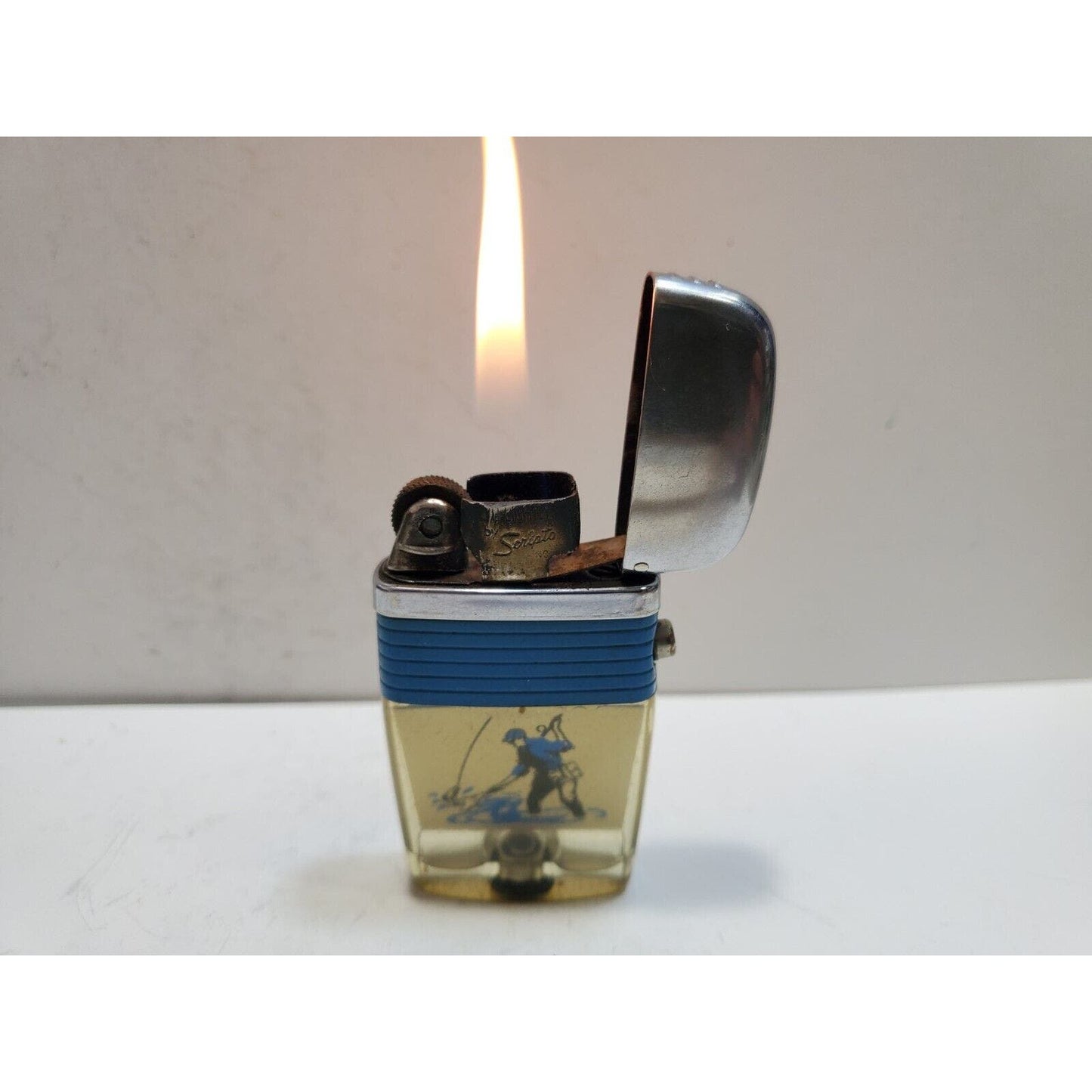 Working Vintage Scripto Fly Fisherman Catching Fish in a Stream-Vu-Lighter Blue
